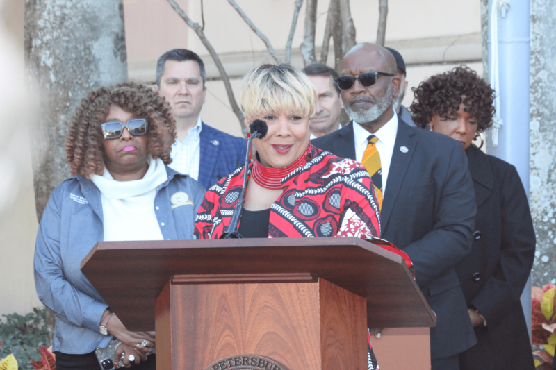 The City of St. Petersburg held its ninth annual Black History Month flag-raising ceremony on Feb. 1 at City Hall.  Terri Lipsey Scott, executive director of the Woodson African American Museum of Florida (center) said, ‘Trust and believe, our stories will be told without compromise or suppression.’